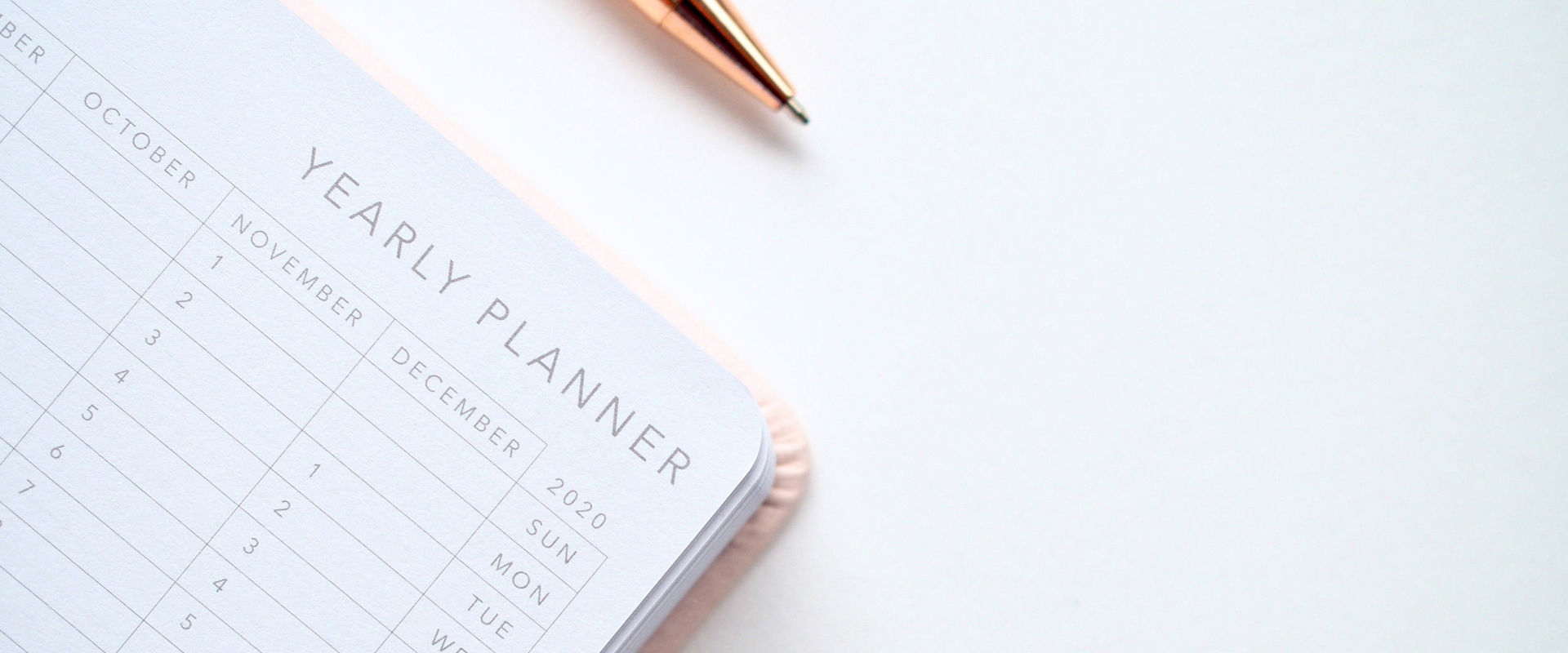 Public holidays Calendar and pen photographed from above.