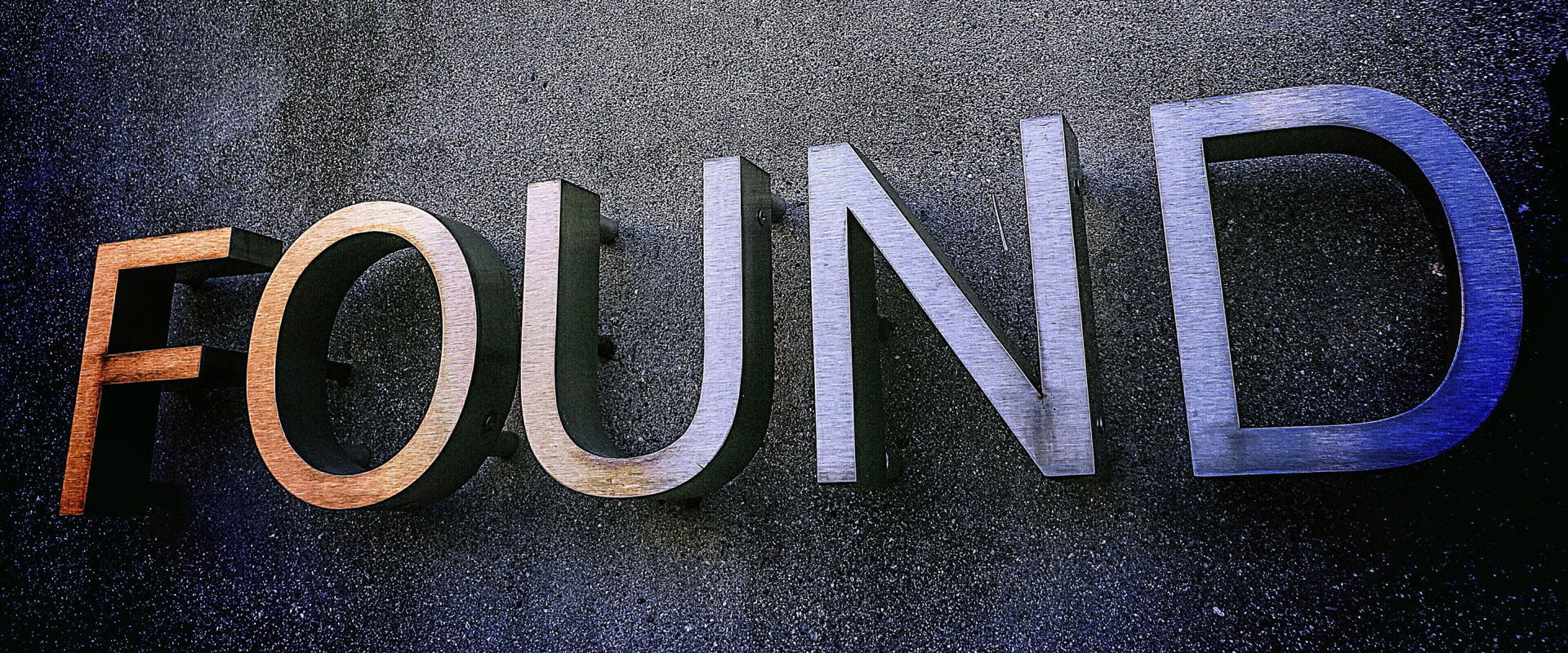 Lost property office Sign with the words "Found" on a wall.