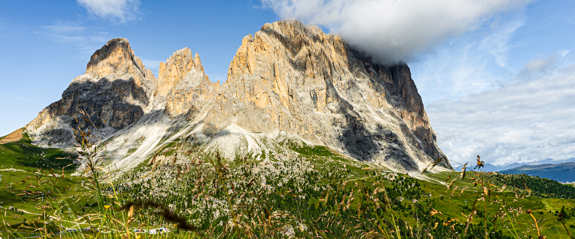 Mt. Langkofel Langkofel with mountain meadow and clouds